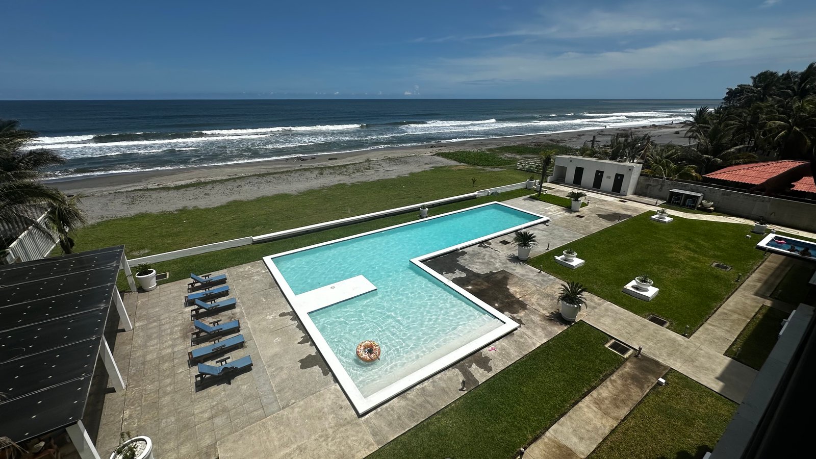 Aerial view of the resort pool with the Pacific Ocean directly behind, Costa del Sol El Salvador