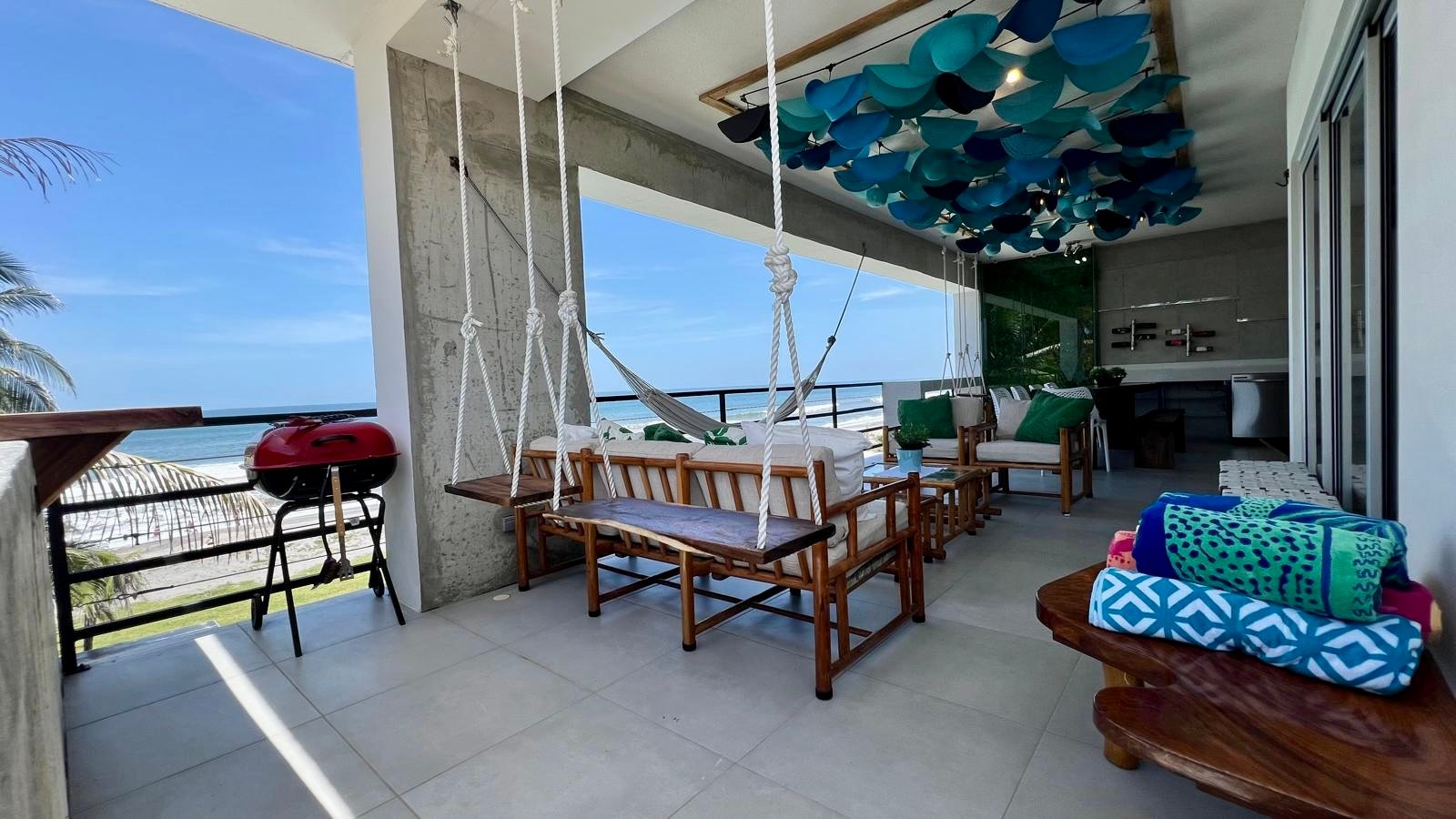 Terrace with swing seats and BBQ