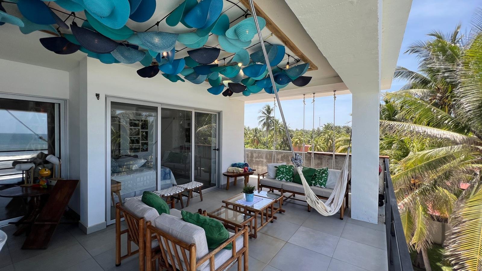 Terrace lounge with hammock and palm trees