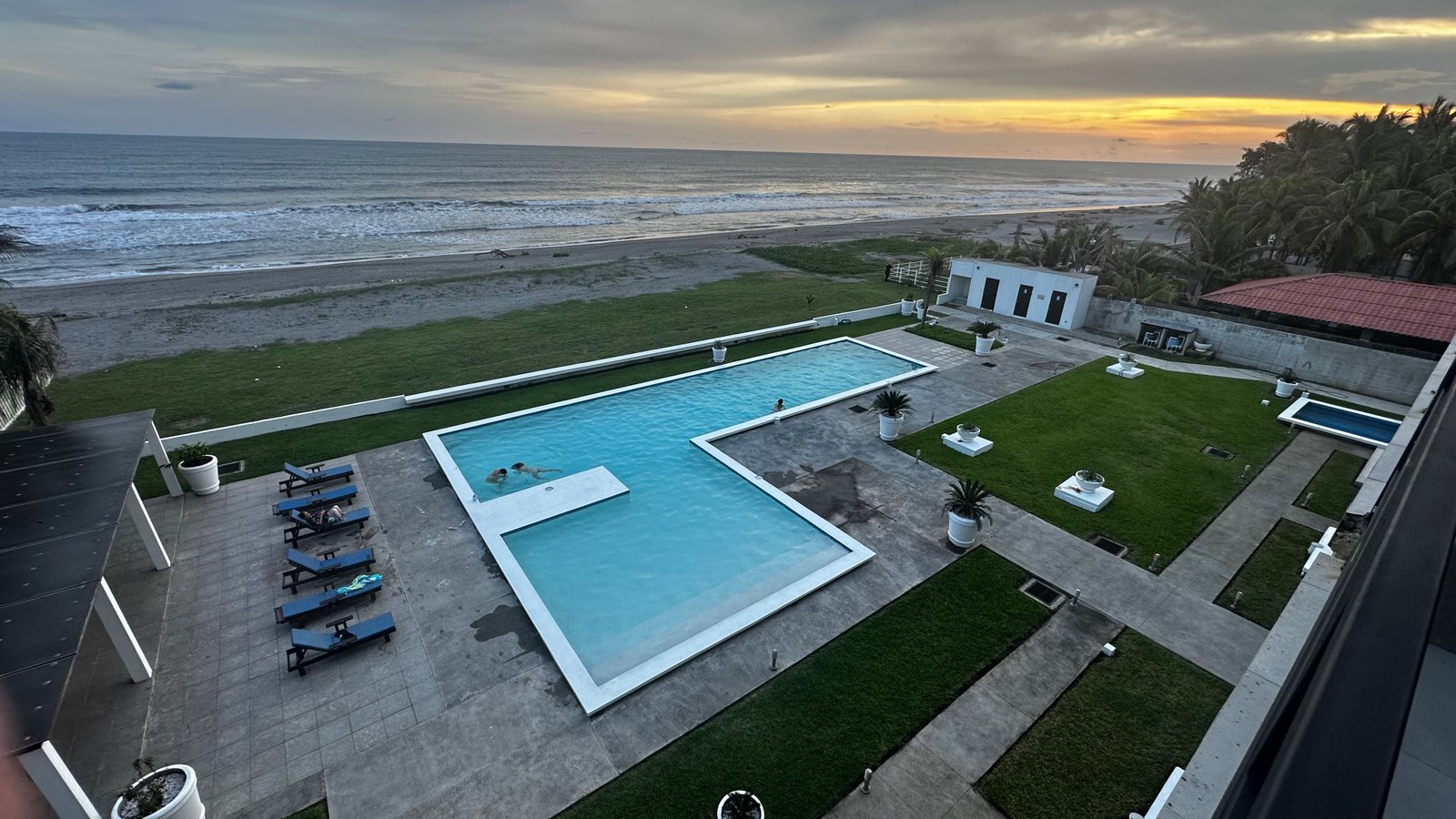 Breathtaking Pacific sunset over the pool